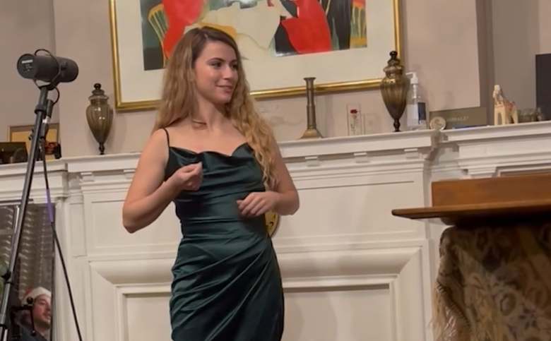 A performer in a green dress at PCC Salon